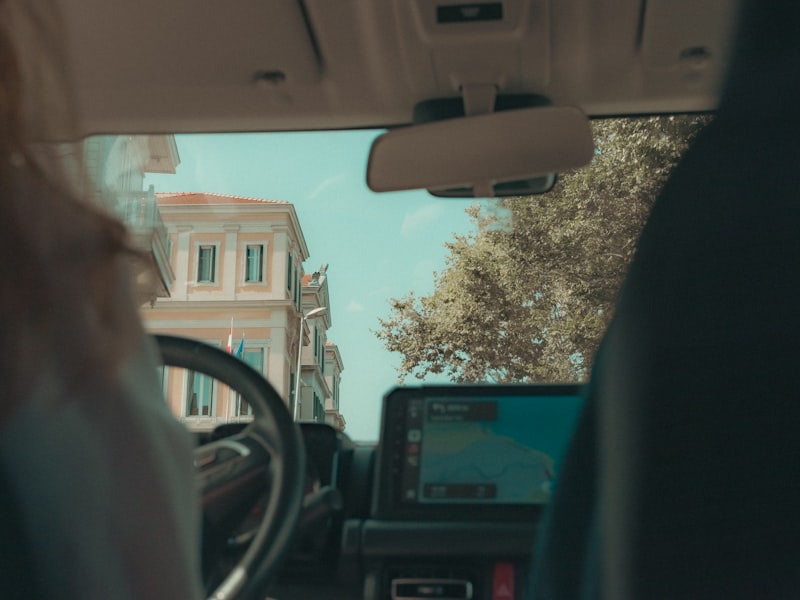 GPS navigation screen showing route tracking on a car dashboard