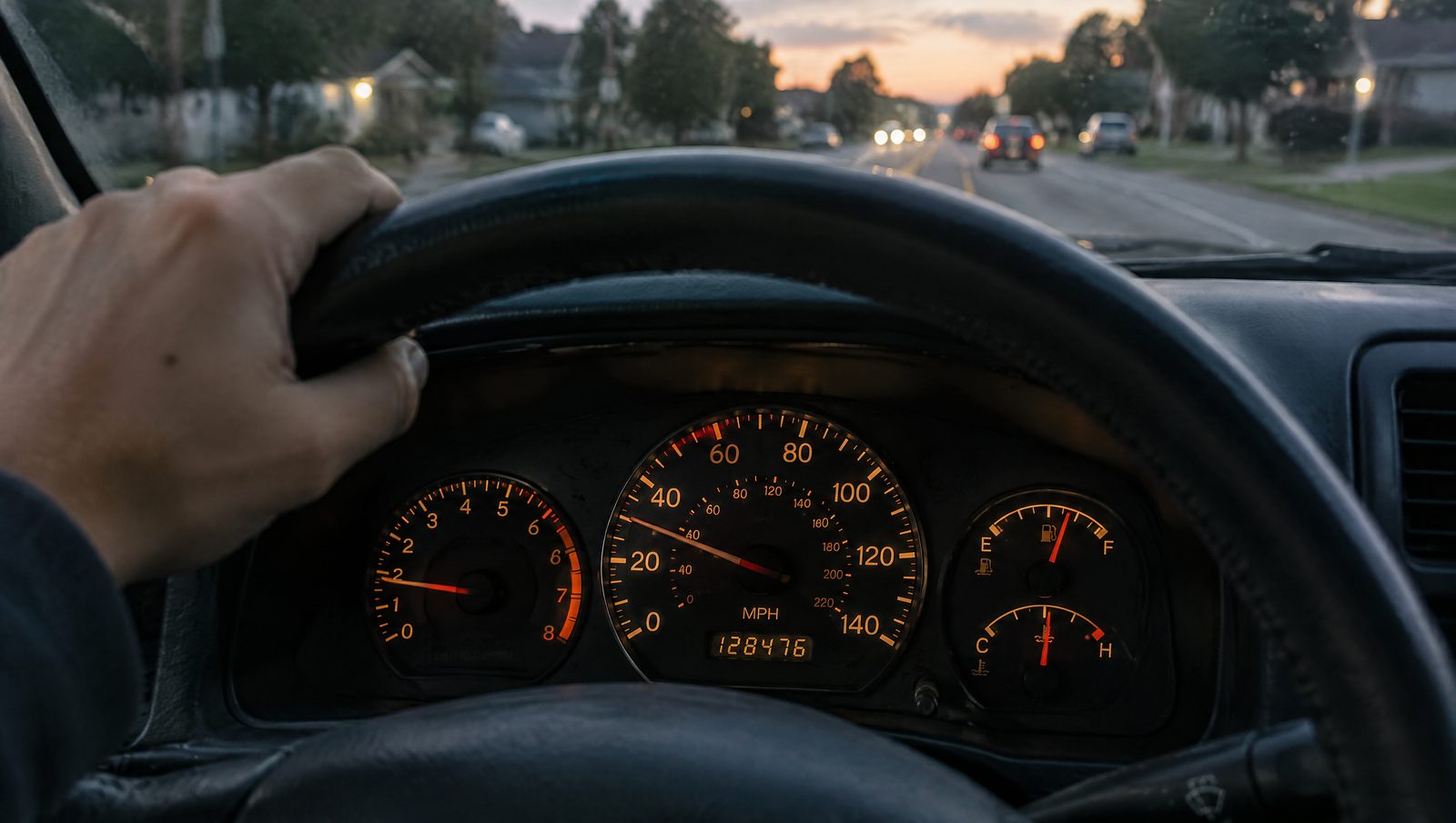 A car odometer on a lit instrument cluster, the reading an ATO logbook needs at the start and end of the 12 weeks